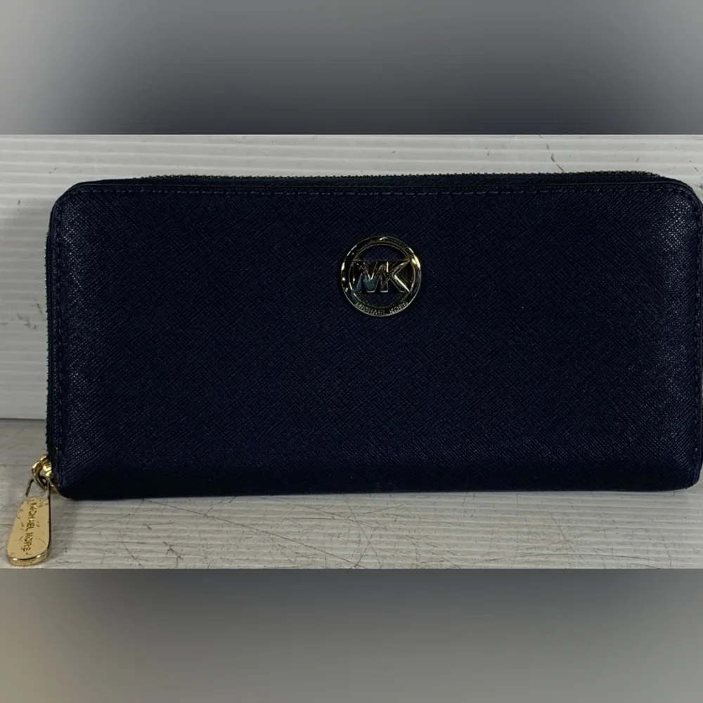 Michael Kors Blue Zip-Around Wallet with Gold Hardware.